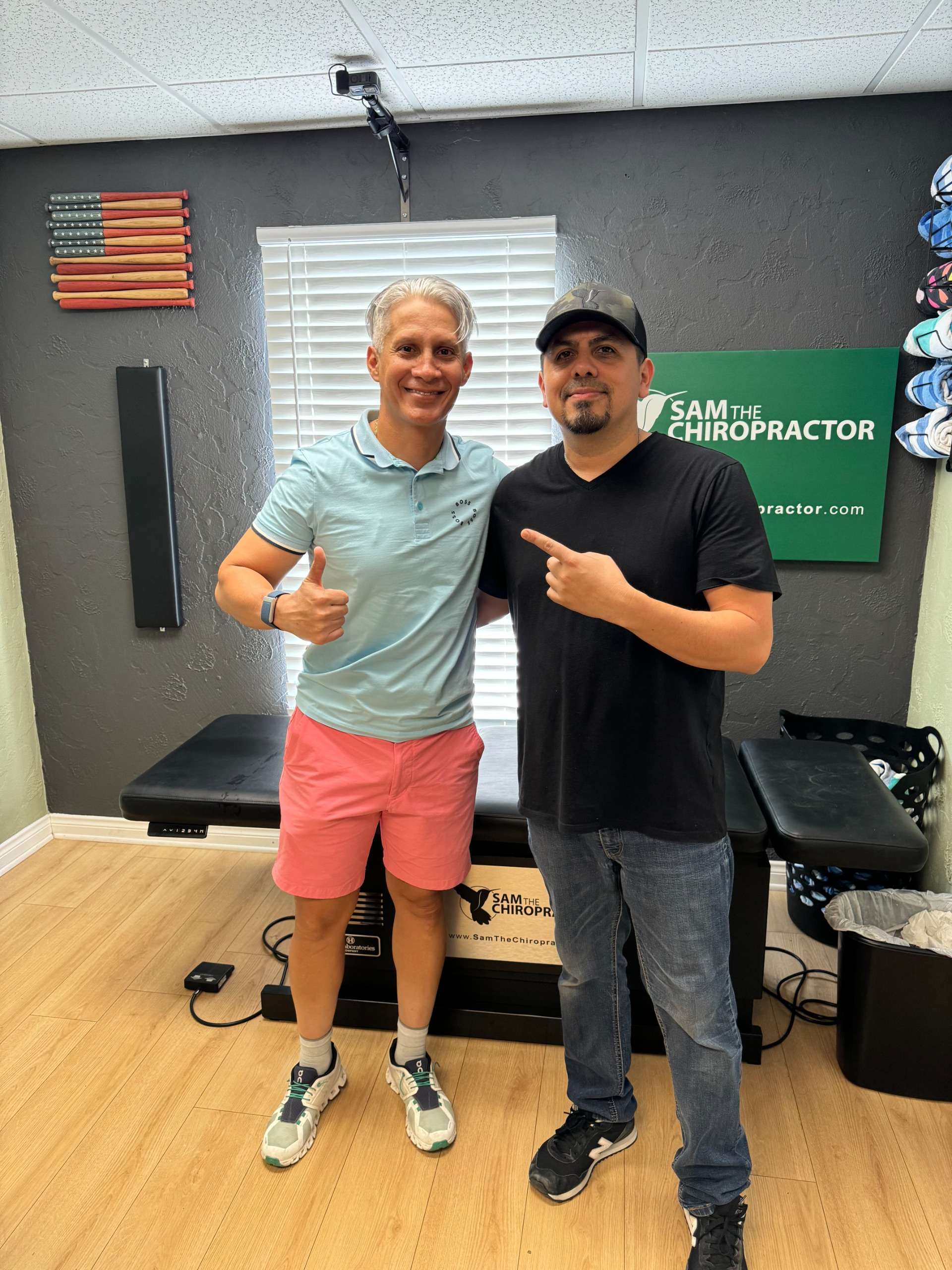 Clients posing with Dr. Sam in the clinic